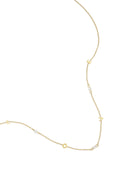 Collar Punti · circonitas espaciadas en acero dorado