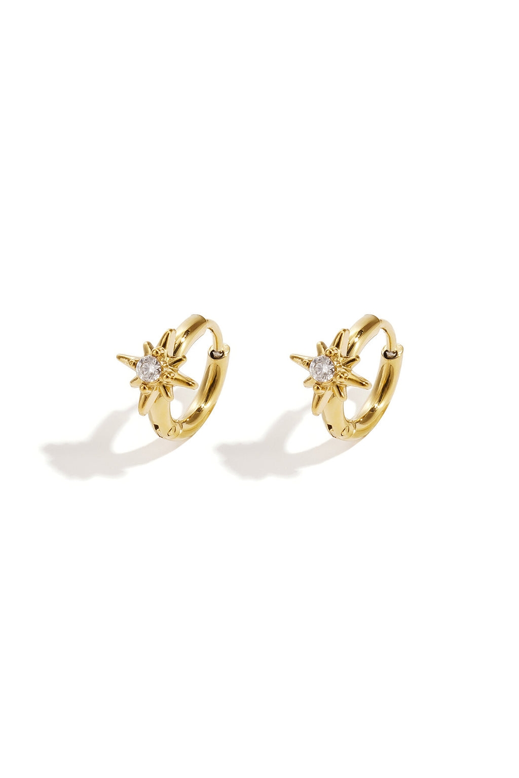 Pendientes Astro · estrella de ocho puntas en acero dorado
