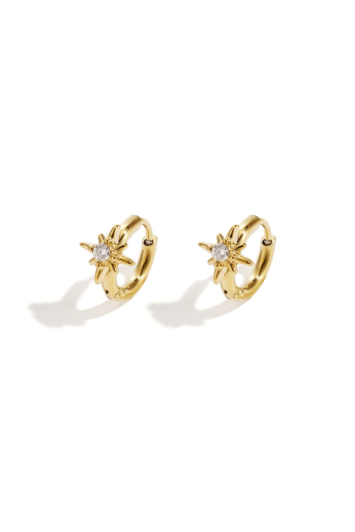 Pendientes Astro · estrella de ocho puntas en acero dorado