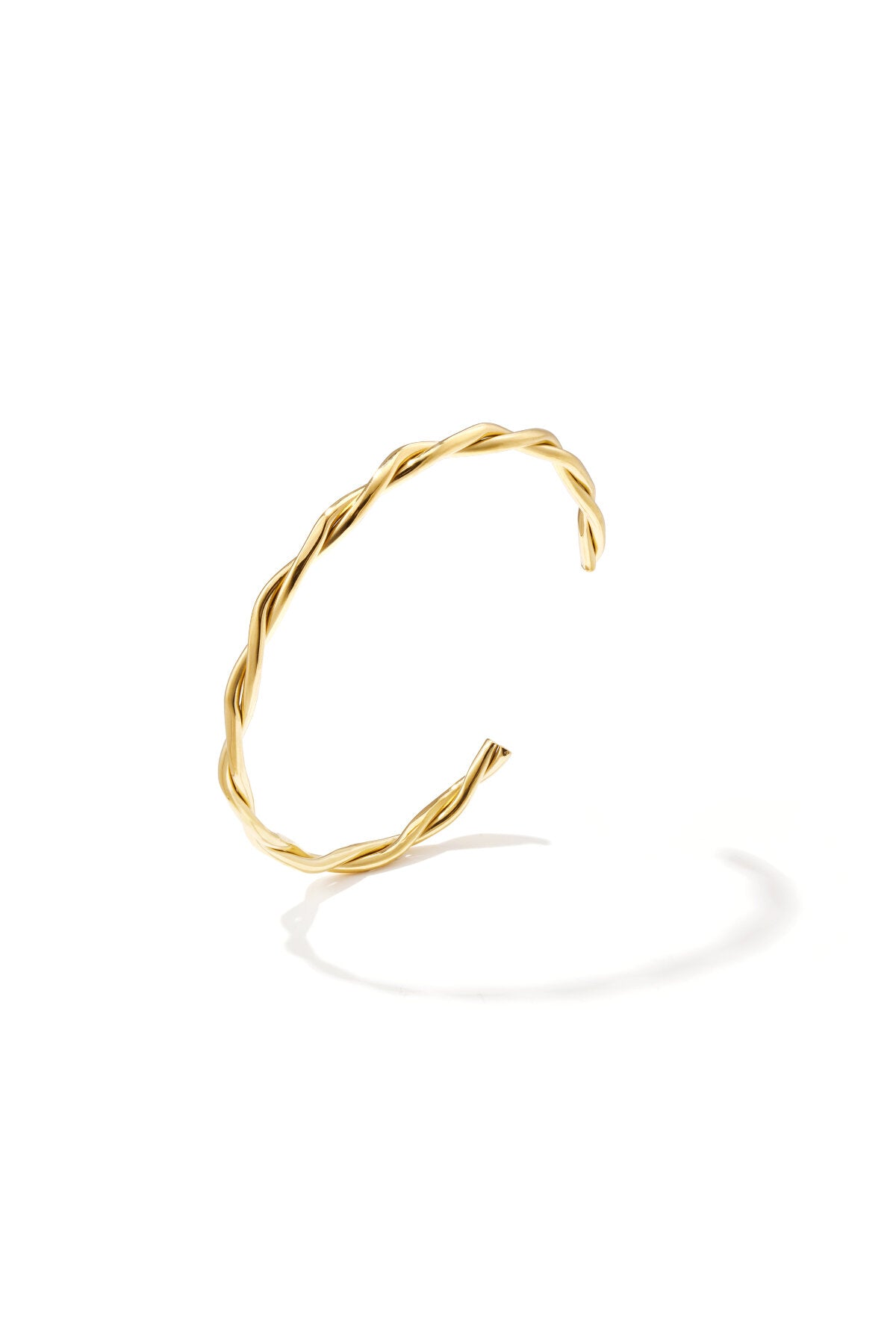 Pulsera Nastro · brazalete con torsión, acero dorado