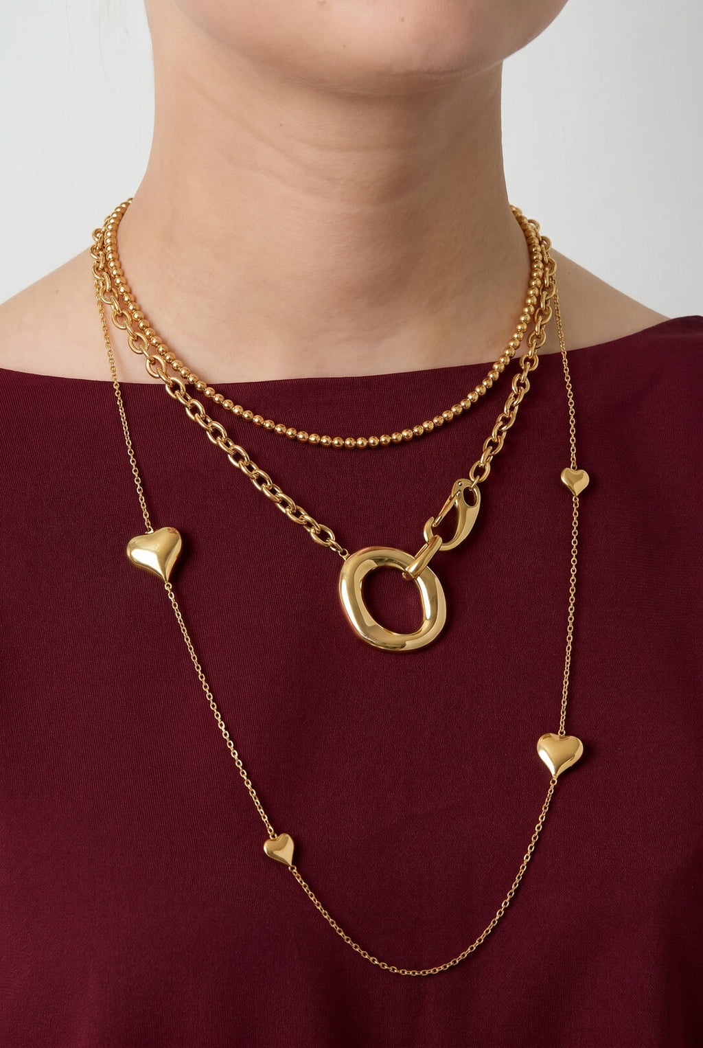 Collar Nodo · aros entrelazados de acero dorado — vista 2