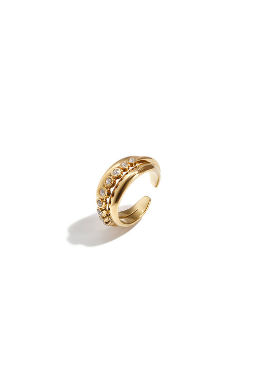 Anillo Bolle · aro ancho con circonitas engastadas, acero dorado