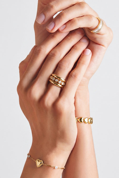 Anillo Bolle · aro ancho con circonitas engastadas, acero dorado — vista 2