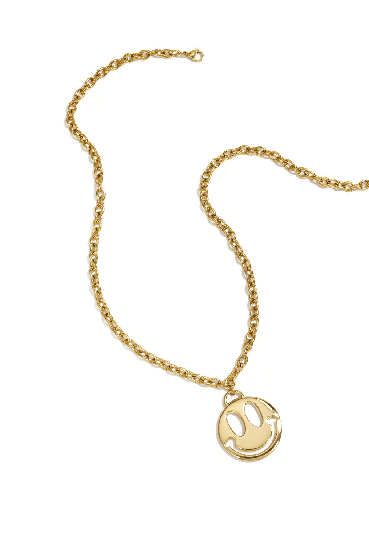 Collar Sorriso · medallón sonriente de acero dorado