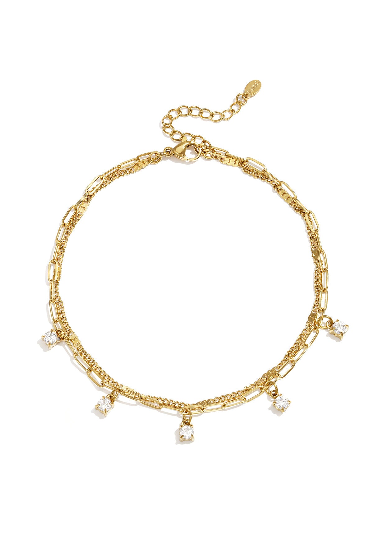 Tobillera Doppia · doble cadena con colgantes de circonita, acero dorado