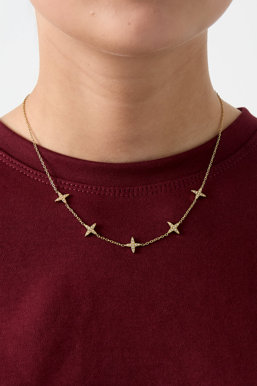 Collar Stelline · motivos de cuatro puntas en acero dorado — vista 2