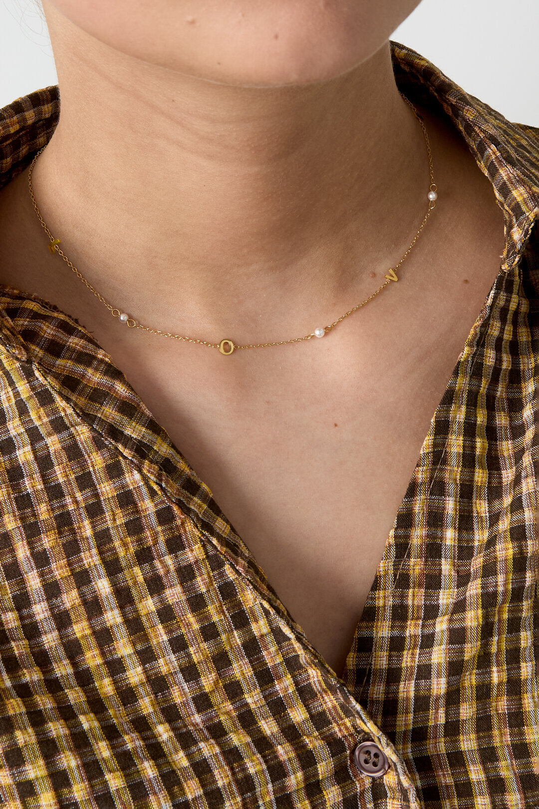 Collar Punti · circonitas espaciadas en acero dorado — vista 2