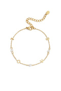 Pulsera Simboli · dijes y perla